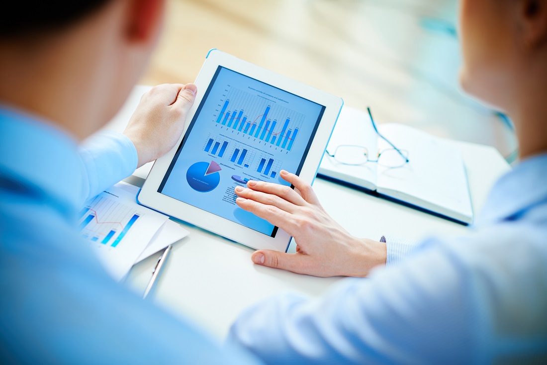 Physician analyzing AI-driven search performance and patient growth data