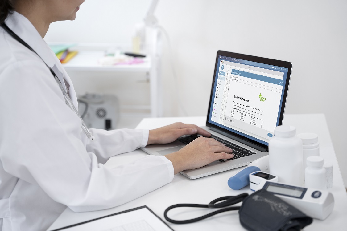 Doctor using digital EHR system for RPM CCM and ACCESS care management