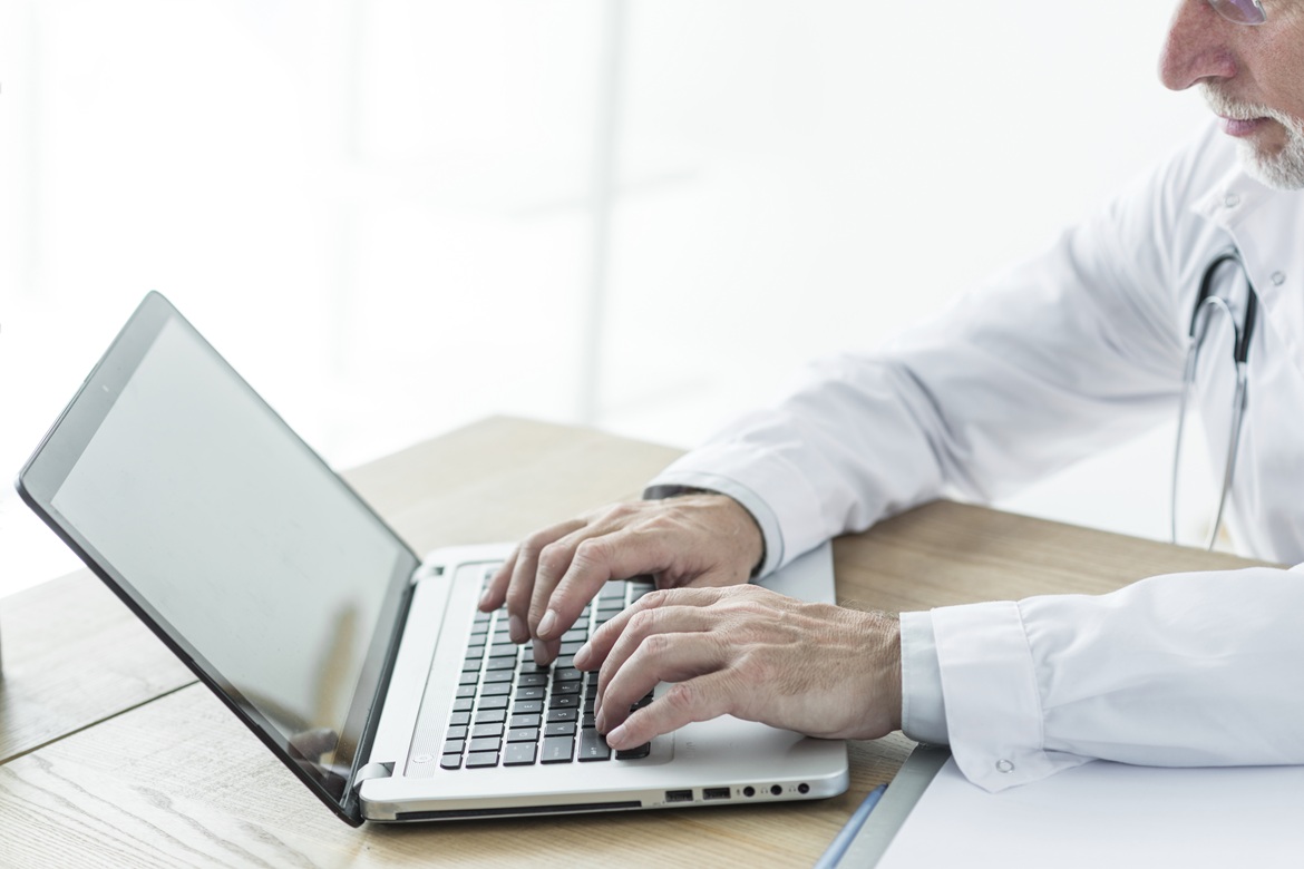 Physician using EHR software in a medical practice